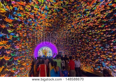 KOLKATA INDIA - OCTOBER 18 2015 : Night image of decorated Durga Puja pandal shot at colored light at Kolkata West Bengal India. Durga Puja is biggest religious festival of Hinduism.