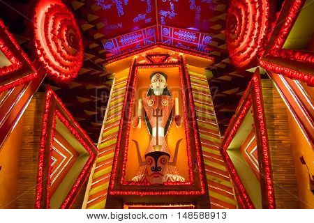 KOLKATA INDIA - OCTOBER 18 2015 : Night image of decorated Durga Puja pandal shot at colored light at Kolkata West Bengal India. Durga Puja is biggest religious festival of Hinduism.