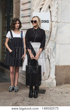 Fashionable Women Posing During Milan Fashion Week