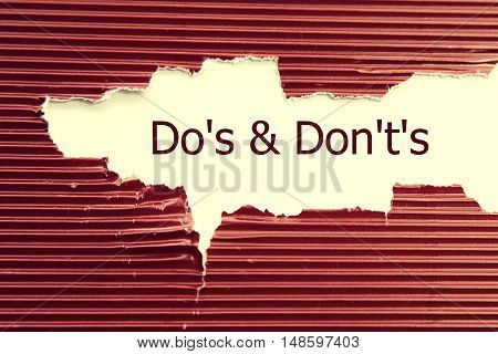 Do's and Don't's Message written under torn paper.