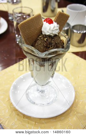 Coffee chocolate sundae with cream and wafers