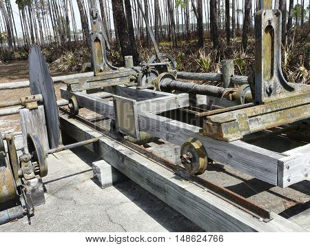A restored turpentine still at St. Andrews State Park, Panama City, Florida, includes the sawmill used to cut wood for the distilling process.