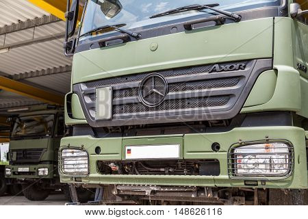 BURG / GERMANY - JUNE 25 : german mercedes benz axor stands under military roof on open day in barrack burg / germany at june 25 2016.