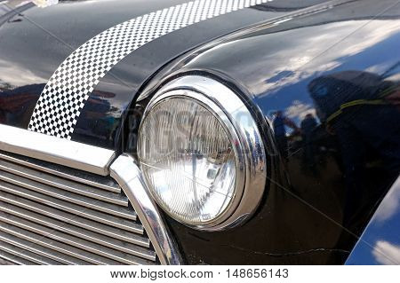 Kharkiv Ukraine - May 22 2016: Close up of retro car black Mini Cooper manufactured in 1966 is presented at the festival of vintage cars Kharkiv Retro Rally - 2016 in Kharkiv Ukraine on May 22 2016