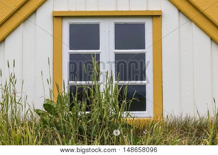 Traditional window and house of grass sods at Byggdasafn Skagfirdinga on Iceland.