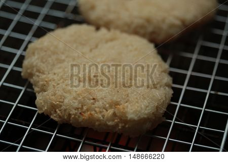sticky rice with egg grilled Asian traditional food (Kgawhie) at street food in Thailand.