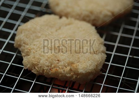 sticky rice with egg grilled Asian traditional food (Kgawhie) at street food in Thailand.