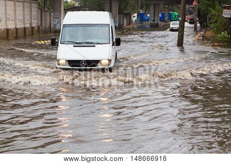 Odessa, Ukraine - September 20, 2016: Driving Cars On A Flooded Road During Flooding Caused By Torre