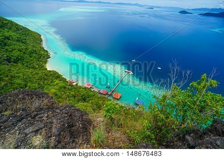 View on top of Bohey Dulang island near Sipadan Island,Sabah,Borneo.Tropical paradise island with bright smooth mirror sand & crystal clear water with rocky shore in the island of Semporna,Borneo