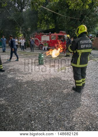 Bangkok Thailand September 24 2016 Fire officials demonstrated how the fire escape and how to use fire extinguisher When fire