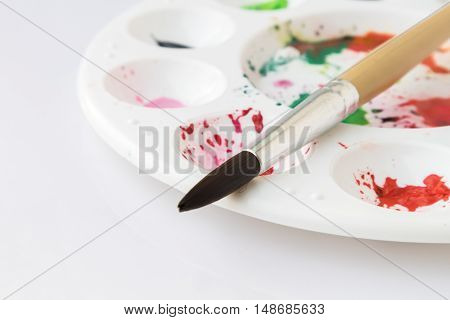 Closeup Paintbrush and Palette with watercolor artist concept