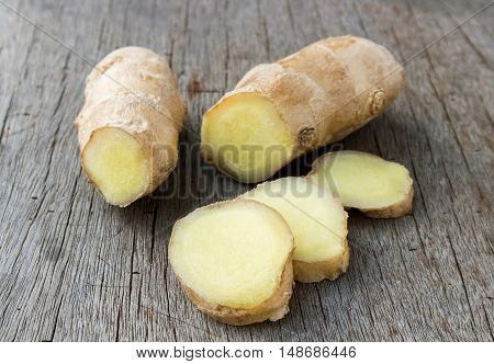 Fresh ginger on old wood backgroundraw material for cooking
