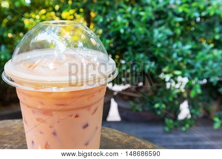 Closeup Ice of thai milk tea milk with nature background