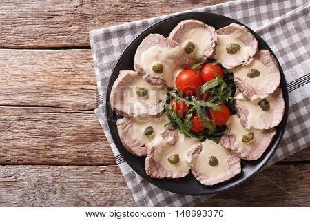 Italian Cuisine: Vitello Tonnato With Capers, Arugula, Tomatoes Close-up. Horizontal Top View