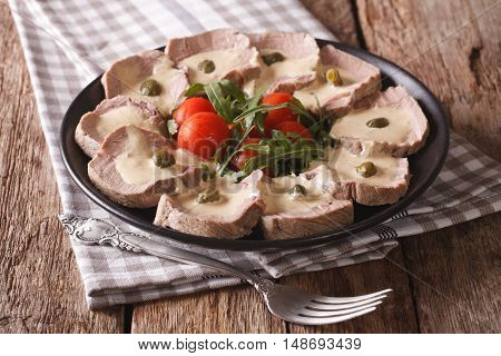 Italian Cuisine: Vitello Tonnato With Capers, Arugula, Tomatoes Close-up. Horizontal