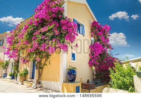 Traditional greek house with flowers in Assos, Kefalonia island, Greece