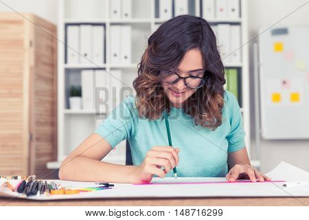Woman engineer is working at a new challenging project. Concept of scrupulous work with good precision
