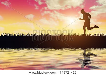 silhouette of jogger in sunset and reflection