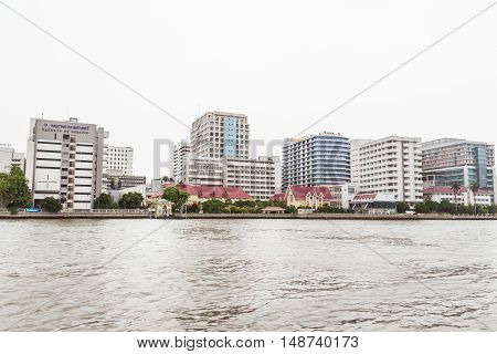 Bangkok Thailand - June 5 2016: Siriraj Hospital view from the other side of Chao Phraya River on cloudy day. It is the oldest and the most famous hospital in Thailand and part of Mahidol university