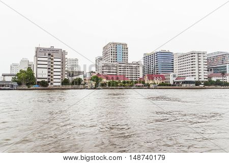 Bangkok Thailand - June 5 2016: Siriraj Hospital view from the other side of Chao Phraya River on cloudy day. It is the oldest and the most famous hospital in Thailand and part of Mahidol university