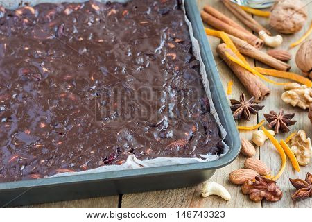 Fresh baked panforte traditional italian christmas dessert with nuts and candied fruits in baking dish horizontal