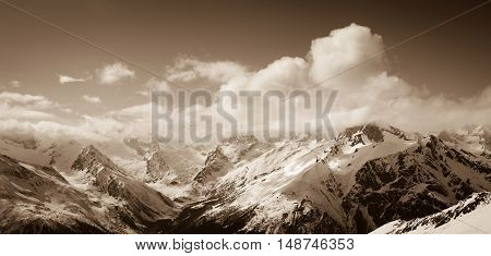 Panorama Of Sunny Winter Mountains In Clouds