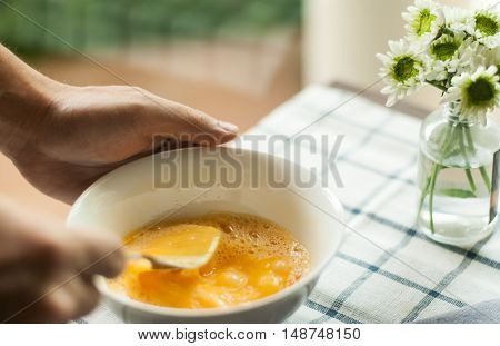 egg prepare for cooking, on the tablecloth and mum flower