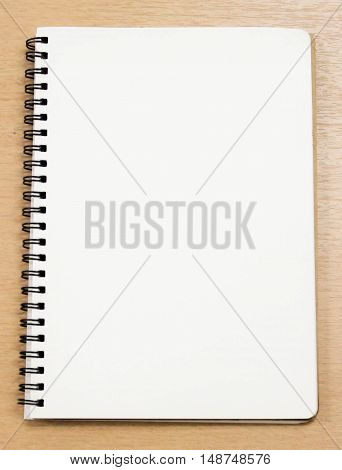 blank notebook on the table, white space for text