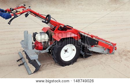 Beach cleaner machine on the seacoast