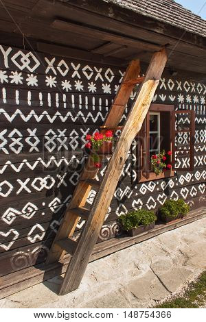 CICMANY, SLOVAK REPUBLIC, AUGUST 23, 2016: Traditional folk architecture. The old wooden house painted ornament. The village Cicmany with the painted wooden houses is on the list of UNESCO.
