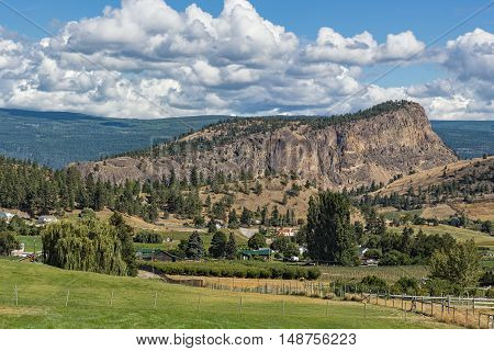 Giants Head Mountain near Summerland British Columbia Canada with farmland in the foreground