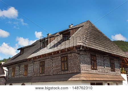 CICMANY, SLOVAK REPUBLIC, AUGUST 23, 2016: Traditional folk architecture. The old wooden house painted ornament. The village Cicmany with the painted wooden houses is on the list of UNESCO.
