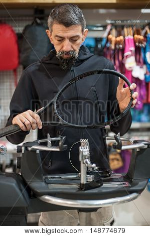 Tennis Stringer Doing Racket Stringing