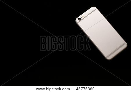 smartphone, mobile phone use in business office black background