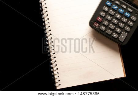 Stationary, Notebook and calculator use in business office black background