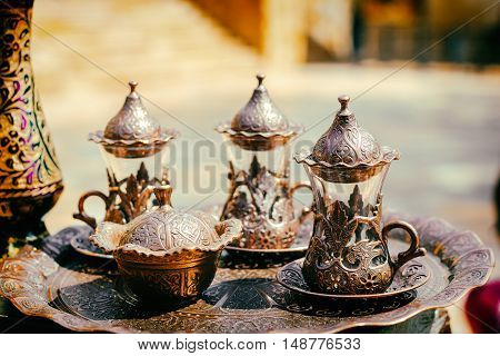 Vintage copper handmade tea cups set  Selective focus. Toned image