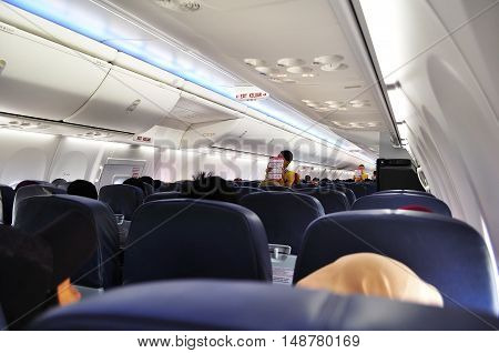 stewardess was telling and demonstrating flight safety instructions