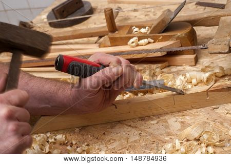 carpenter workinghammermeter and screw-driver on construction background.