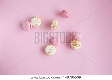 top view of tasty pink and white macaroons raspberry and vanilla flavor