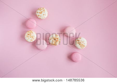 top view of tasty pink and white macaroons raspberry and vanilla flavor