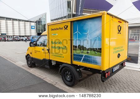 HANNOVER GERMANY - 23 2016: New electric mail delivery van from the Deutsche Post DHL at the IAA Commercial Vehicles 2016 International Trade Fair