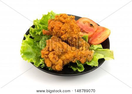Fried chicken slices with lettuce lsolated on white background.