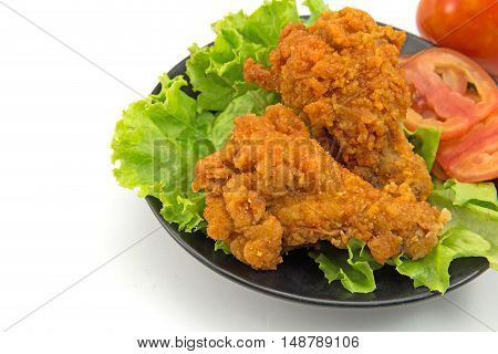 Fried chicken slices with lettuce lsolated on white background.