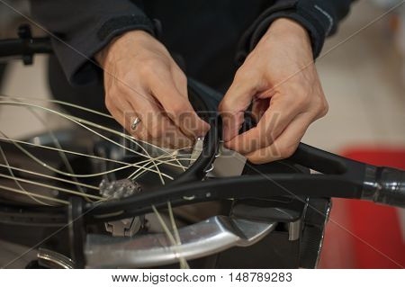 Close Up Of Tennis Stringer Hands Doing Racket Stringing