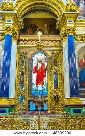 SAINT PETERSBURG RUSSIA - APRIL 25 2015: The altar of St Isaac's Cathedral decorated with the stained-glass window depicting Jesus Christ blessing the worshipers on April 25 in Saint Petersburg.