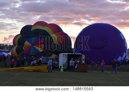 QUEENSBURY, NY - SEP 24: Balloon launch at dawn at the 2016 Adirondack Hot Air Balloon Festival held from Sep 22-25. Thousands of people attended the festival which is the largest of its kind on the East coast.
