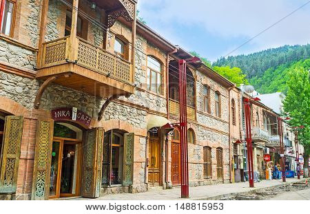 BORJOMI GEORGIA - MAY 26 2016: The tourist street with the renovated stone houses with souvenir stalls cafes of local cuisine wine shops on May 26 in Borjomi.