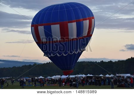 QUEENSBURY, NY - SEP 24: Balloon launch at dawn at the 2016 Adirondack Hot Air Balloon Festival held from Sep 22-25. Thousands of people attended the festival which is the largest of its kind on the East coast.