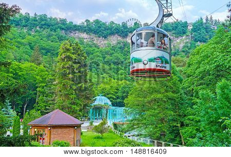 BORJOMI GEORGIA - MAY 27 2016: One of the favorite tourist attractions in resort is the cable car ride over the Mineral Water Park and Borjomi Gorge on May 27 in Borjomi.
