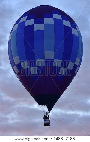 QUEENSBURY, NY - SEP 24: Balloon launch at dawn at the 2016 Adirondack Hot Air Balloon Festival held from Sep 22-25. Thousands of people attended the festival which is the largest of its kind on the East coast.